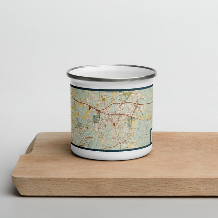 Front View Custom Covington Georgia Map Enamel Mug in Woodblock on Cutting Board
