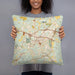 Person holding 18x18 Custom Covington Georgia Map Throw Pillow in Woodblock