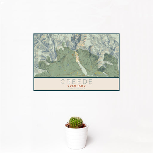 12x18 Creede Colorado Map Print Landscape Orientation in Woodblock Style With Small Cactus Plant in White Planter