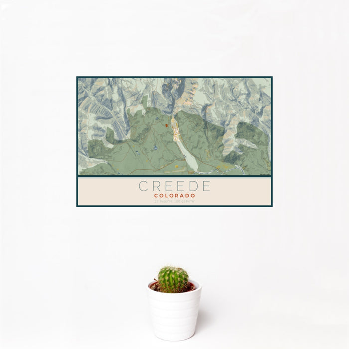 12x18 Creede Colorado Map Print Landscape Orientation in Woodblock Style With Small Cactus Plant in White Planter