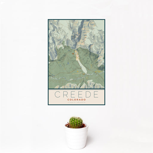 12x18 Creede Colorado Map Print Portrait Orientation in Woodblock Style With Small Cactus Plant in White Planter