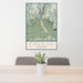 24x36 Creede Colorado Map Print Portrait Orientation in Woodblock Style Behind 2 Chairs Table and Potted Plant