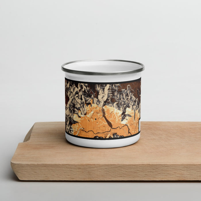 Front View Custom Creede Colorado Map Enamel Mug in Ember on Cutting Board