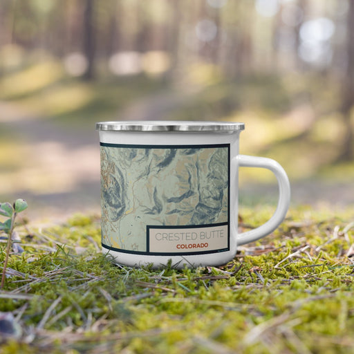 Right View Custom Crested Butte Colorado Map Enamel Mug in Woodblock on Grass With Trees in Background