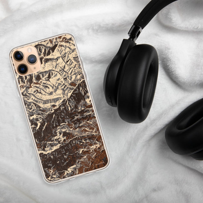 Custom Custer Gallatin National Forest Map Phone Case in Ember on Table with Black Headphones