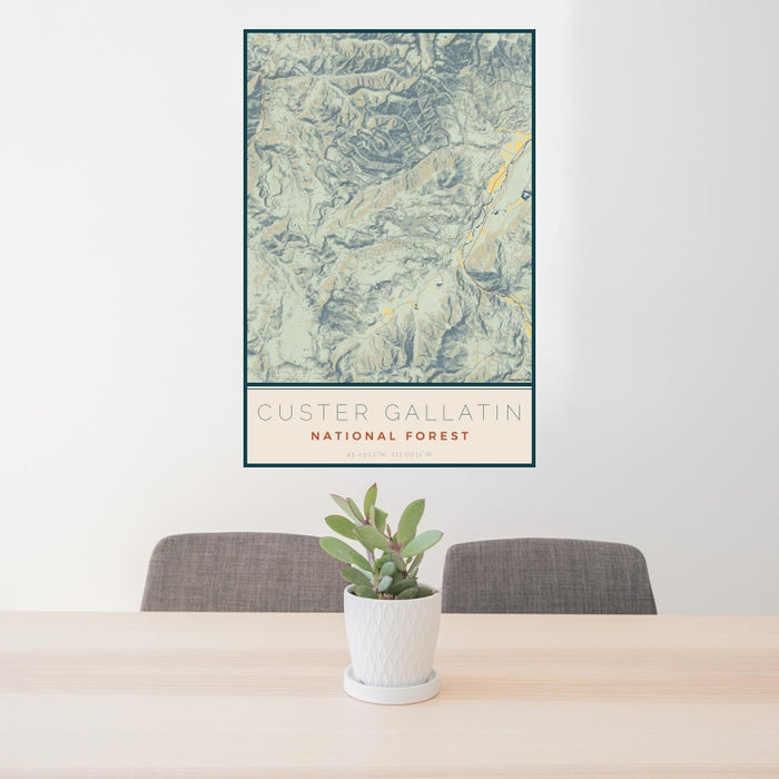 24x36 Custer Gallatin National Forest Map Print Portrait Orientation in Woodblock Style Behind 2 Chairs Table and Potted Plant