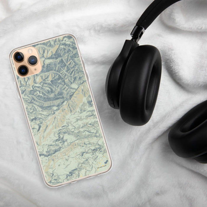 Custom Custer Gallatin National Forest Map Phone Case in Woodblock on Table with Black Headphones
