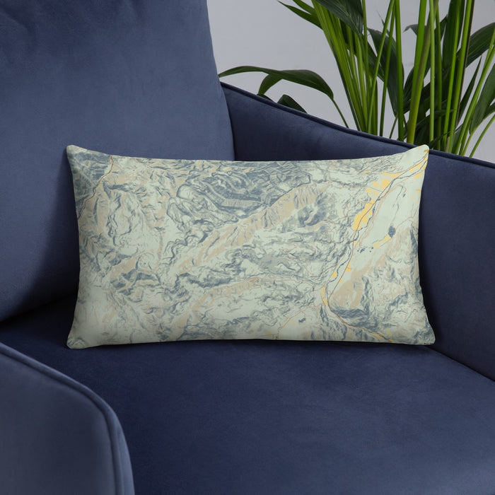 Custom Custer Gallatin National Forest Map Throw Pillow in Woodblock on Blue Colored Chair