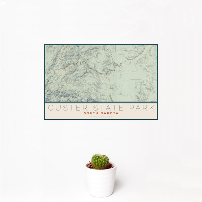 12x18 Custer State Park South Dakota Map Print Landscape Orientation in Woodblock Style With Small Cactus Plant in White Planter