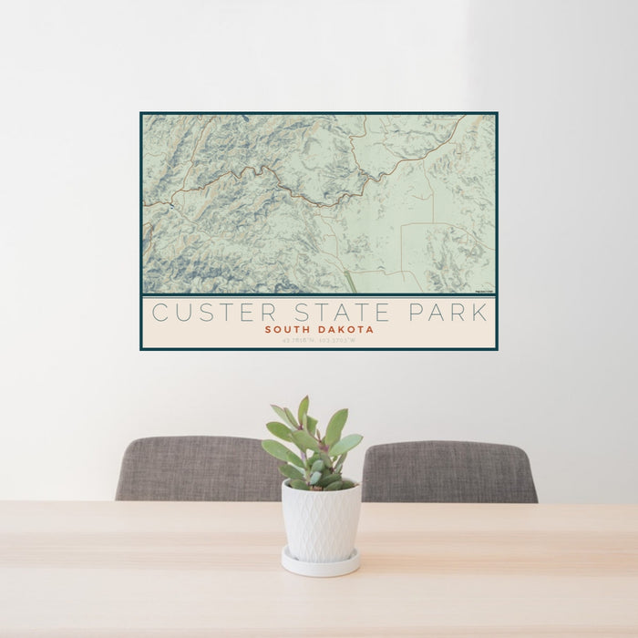 24x36 Custer State Park South Dakota Map Print Lanscape Orientation in Woodblock Style Behind 2 Chairs Table and Potted Plant