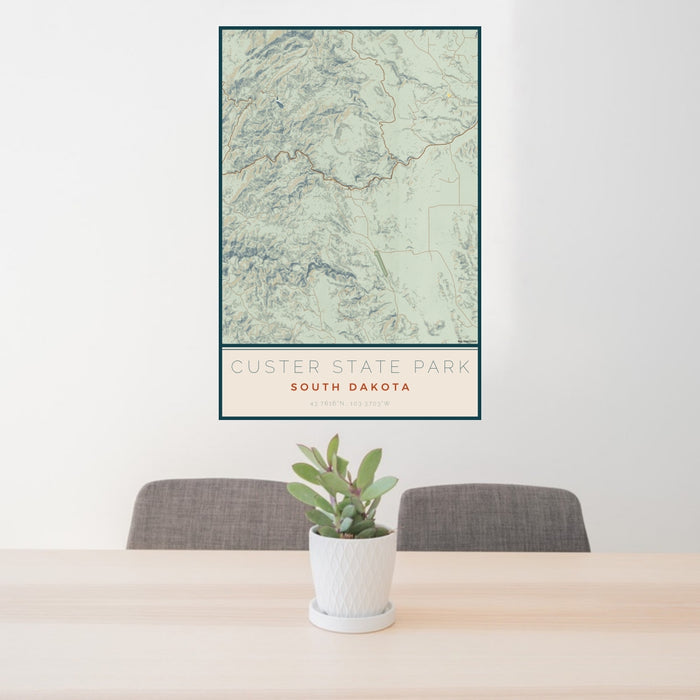 24x36 Custer State Park South Dakota Map Print Portrait Orientation in Woodblock Style Behind 2 Chairs Table and Potted Plant