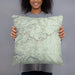 Person holding 18x18 Custom Custer State Park South Dakota Map Throw Pillow in Woodblock