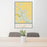24x36 Cut Bank Montana Map Print Portrait Orientation in Woodblock Style Behind 2 Chairs Table and Potted Plant