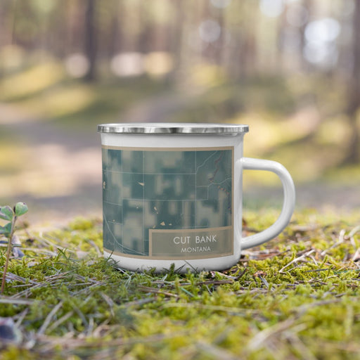 Right View Custom Cut Bank Montana Map Enamel Mug in Afternoon on Grass With Trees in Background