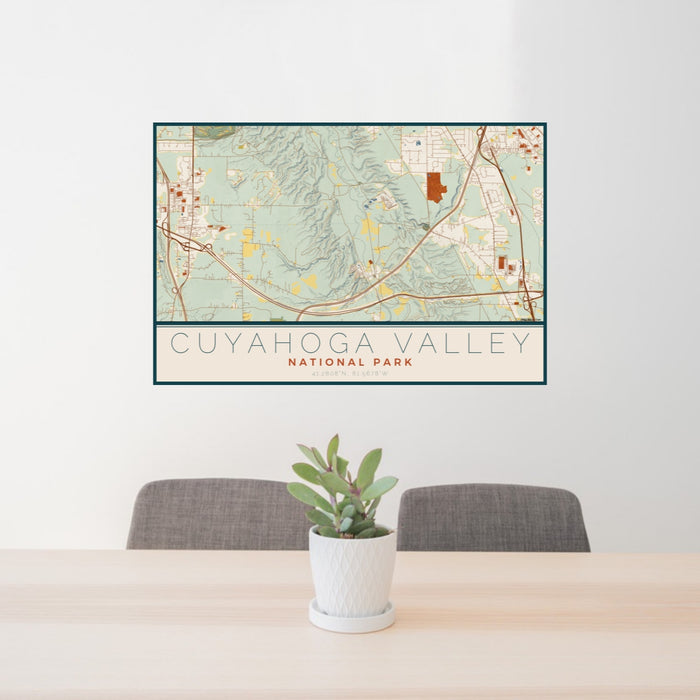 24x36 Cuyahoga Valley National Park Map Print Lanscape Orientation in Woodblock Style Behind 2 Chairs Table and Potted Plant