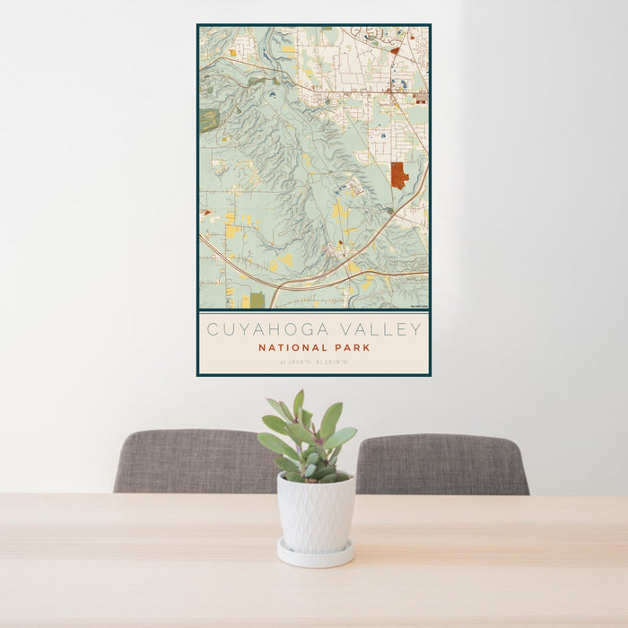 24x36 Cuyahoga Valley National Park Map Print Portrait Orientation in Woodblock Style Behind 2 Chairs Table and Potted Plant