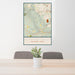 24x36 Cuyahoga Valley National Park Map Print Portrait Orientation in Woodblock Style Behind 2 Chairs Table and Potted Plant