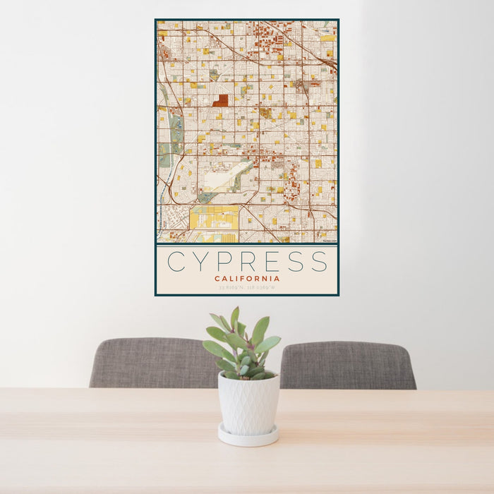 24x36 Cypress California Map Print Portrait Orientation in Woodblock Style Behind 2 Chairs Table and Potted Plant