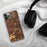 Custom Cypress California Map Phone Case in Ember on Table with Black Headphones
