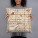Person holding 18x18 Custom Cypress California Map Throw Pillow in Woodblock
