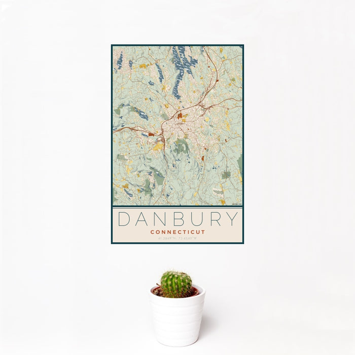 12x18 Danbury Connecticut Map Print Portrait Orientation in Woodblock Style With Small Cactus Plant in White Planter