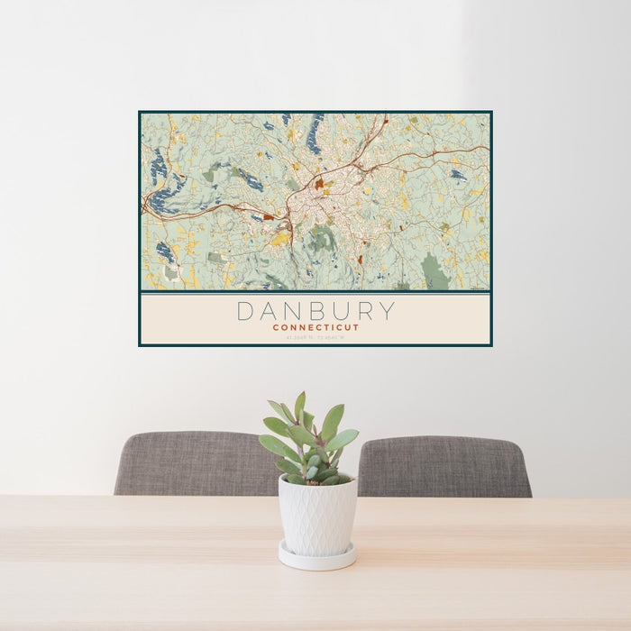 24x36 Danbury Connecticut Map Print Landscape Orientation in Woodblock Style Behind 2 Chairs Table and Potted Plant