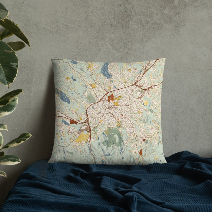 Custom Danbury Connecticut Map Throw Pillow in Woodblock on Bedding Against Wall