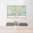 24x36 Darien Georgia Map Print Lanscape Orientation in Woodblock Style Behind 2 Chairs Table and Potted Plant