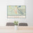 24x36 Darrington Washington Map Print Lanscape Orientation in Woodblock Style Behind 2 Chairs Table and Potted Plant