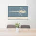 24x36 Dauphin Island Alabama Map Print Landscape Orientation in Woodblock Style Behind 2 Chairs Table and Potted Plant