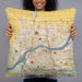 Person holding 22x22 Custom Davenport Iowa Map Throw Pillow in Woodblock