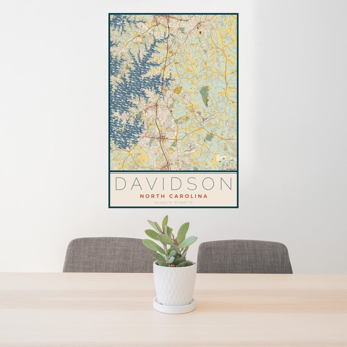 24x36 Davidson North Carolina Map Print Portrait Orientation in Woodblock Style Behind 2 Chairs Table and Potted Plant