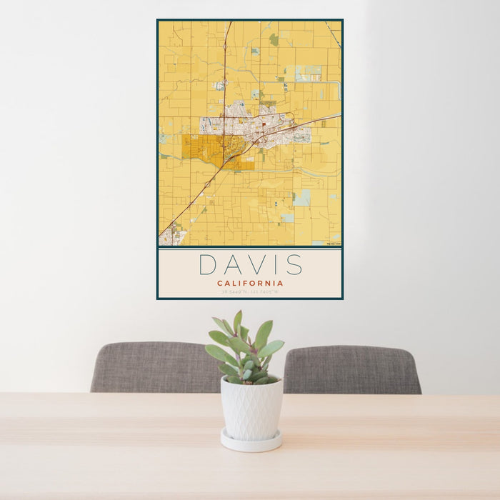 24x36 Davis California Map Print Portrait Orientation in Woodblock Style Behind 2 Chairs Table and Potted Plant
