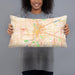 Person holding 20x12 Custom Dayton Ohio Map Throw Pillow in Watercolor