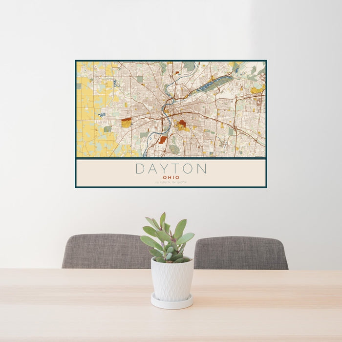 24x36 Dayton Ohio Map Print Landscape Orientation in Woodblock Style Behind 2 Chairs Table and Potted Plant