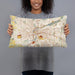 Person holding 20x12 Custom Dayton Ohio Map Throw Pillow in Woodblock