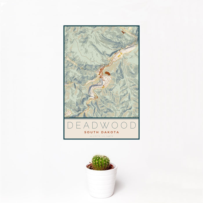 12x18 Deadwood South Dakota Map Print Portrait Orientation in Woodblock Style With Small Cactus Plant in White Planter