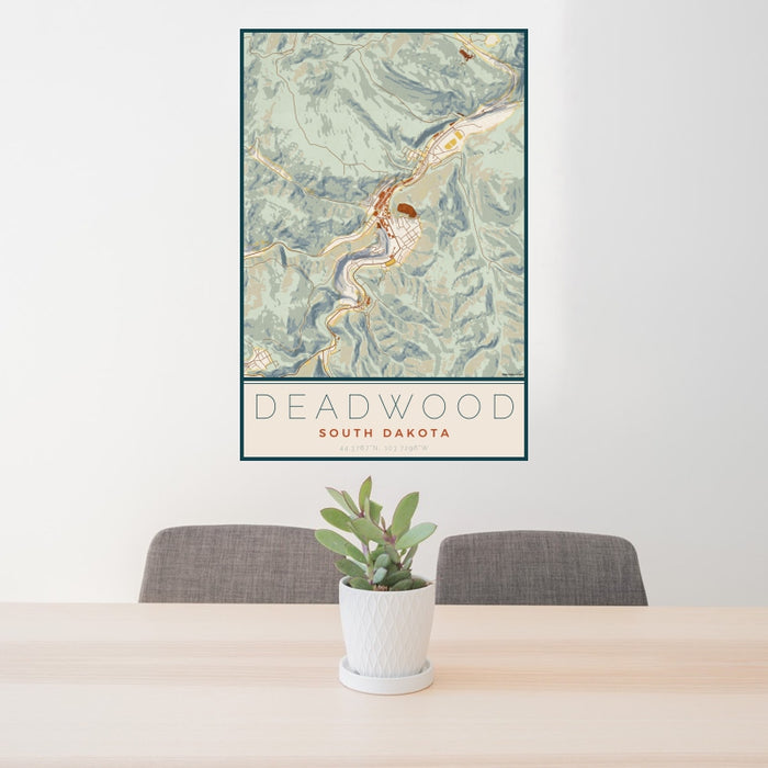 24x36 Deadwood South Dakota Map Print Portrait Orientation in Woodblock Style Behind 2 Chairs Table and Potted Plant