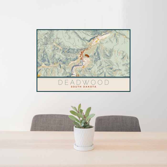 24x36 Deadwood South Dakota Map Print Landscape Orientation in Woodblock Style Behind 2 Chairs Table and Potted Plant