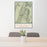 24x36 Death Valley National Park Map Print Portrait Orientation in Woodblock Style Behind 2 Chairs Table and Potted Plant