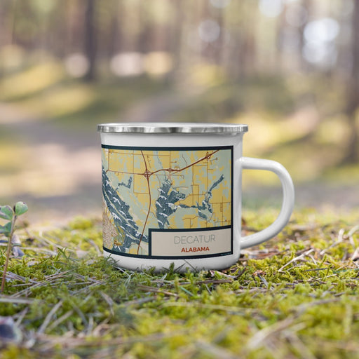 Right View Custom Decatur Alabama Map Enamel Mug in Woodblock on Grass With Trees in Background