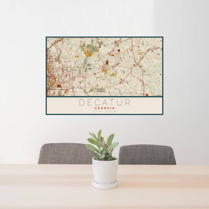 24x36 Decatur Georgia Map Print Lanscape Orientation in Woodblock Style Behind 2 Chairs Table and Potted Plant