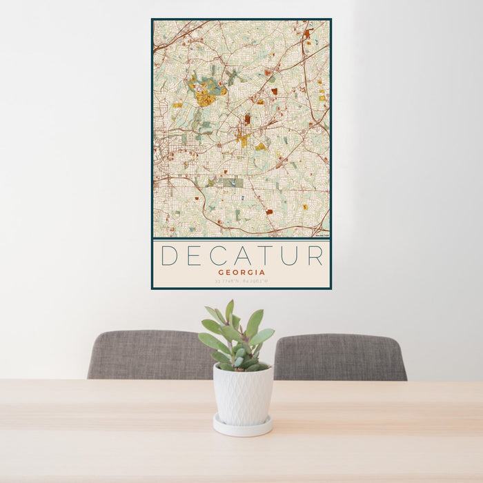24x36 Decatur Georgia Map Print Portrait Orientation in Woodblock Style Behind 2 Chairs Table and Potted Plant