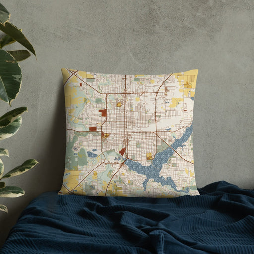 Custom Decatur Illinois Map Throw Pillow in Woodblock on Bedding Against Wall