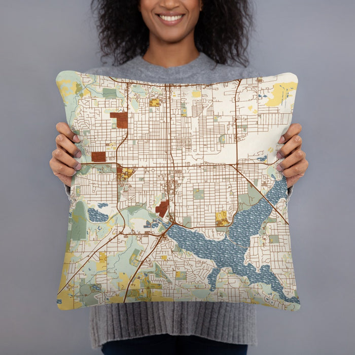 Person holding 18x18 Custom Decatur Illinois Map Throw Pillow in Woodblock