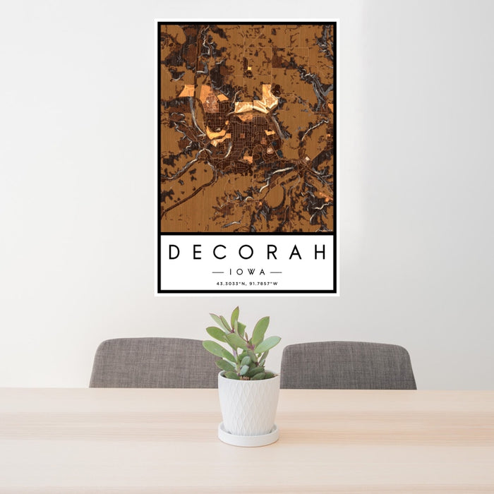24x36 Decorah Iowa Map Print Portrait Orientation in Ember Style Behind 2 Chairs Table and Potted Plant
