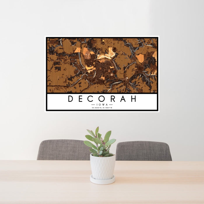 24x36 Decorah Iowa Map Print Landscape Orientation in Ember Style Behind 2 Chairs Table and Potted Plant