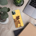 Custom Delano California Map Phone Case in Ember on Table with Laptop and Plant
