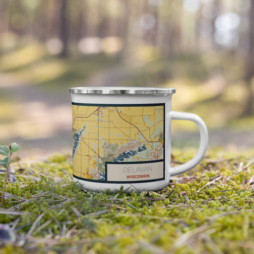 Right View Custom Delavan Wisconsin Map Enamel Mug in Woodblock on Grass With Trees in Background