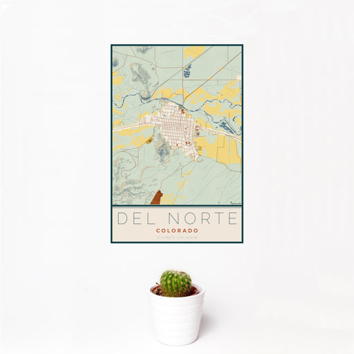 12x18 Del Norte Colorado Map Print Portrait Orientation in Woodblock Style With Small Cactus Plant in White Planter